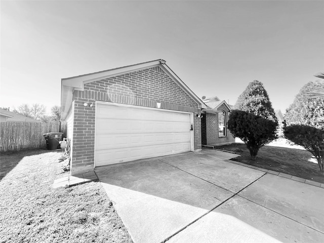 view of side of home with a garage