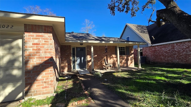 exterior space with a garage and a yard