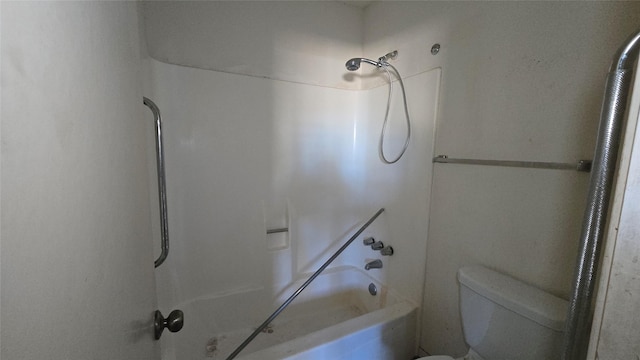 bathroom featuring toilet and bathing tub / shower combination