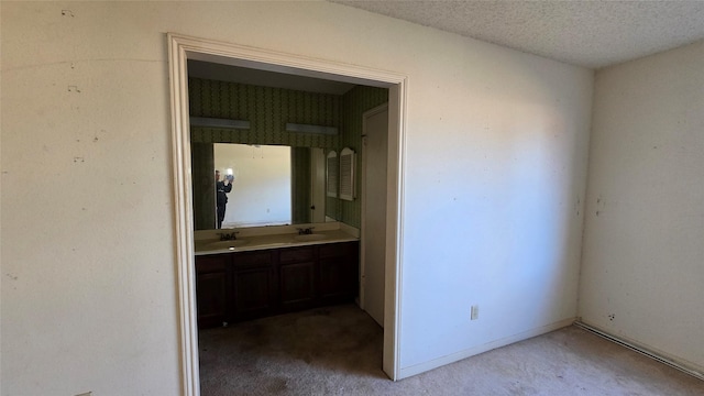 bathroom featuring vanity and a textured ceiling