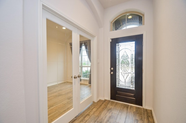 entrance foyer with hardwood / wood-style flooring and french doors