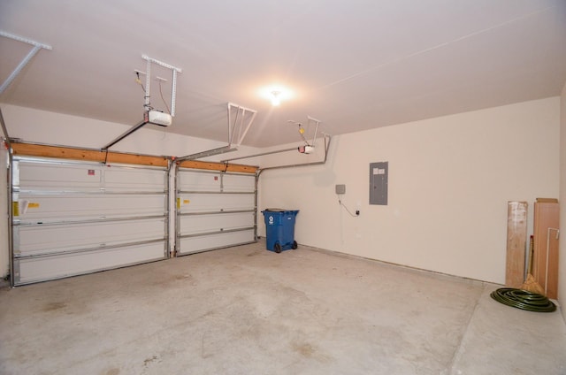 garage featuring a garage door opener and electric panel