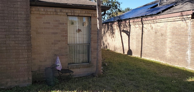 view of home's exterior with a yard