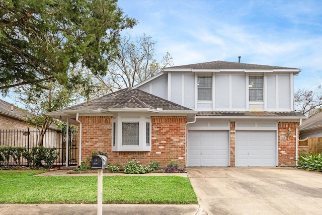 view of front of home featuring a garage and a front yard