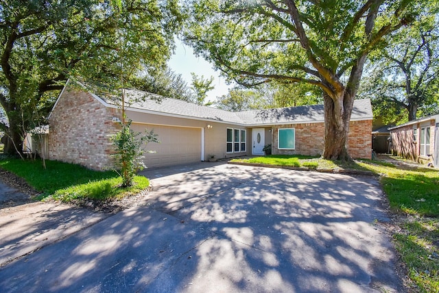 ranch-style home with a garage