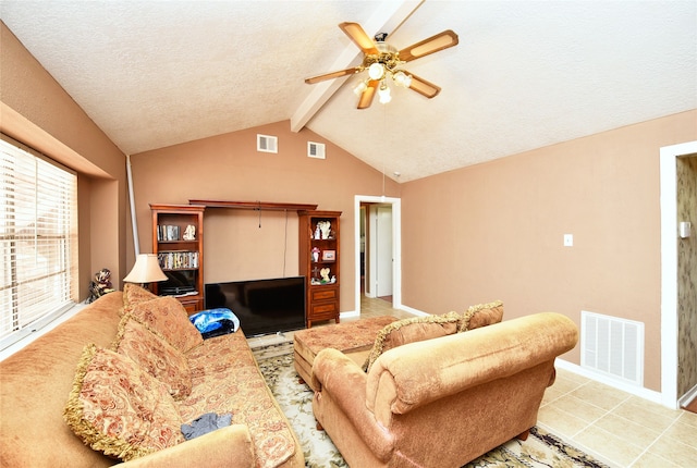 living room featuring light tile patterned floors, vaulted ceiling with beams, a textured ceiling, and ceiling fan