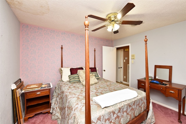 bedroom with carpet flooring, ceiling fan, and a textured ceiling