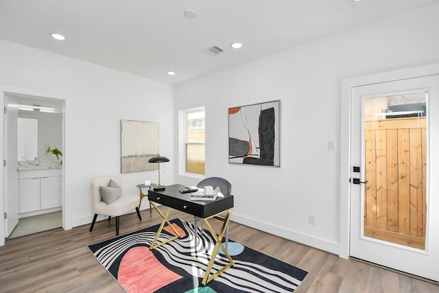 living area with hardwood / wood-style floors