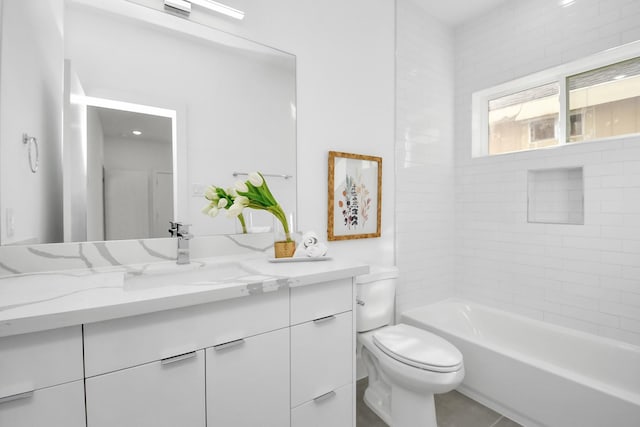 full bathroom featuring tile patterned floors, vanity, tiled shower / bath combo, and toilet