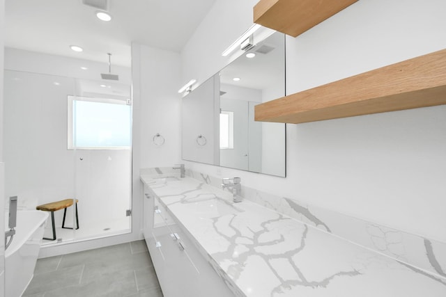 bathroom featuring a wealth of natural light, vanity, and shower with separate bathtub