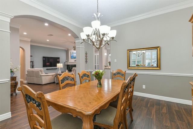 dining room featuring a chandelier, dark hardwood / wood-style floors, and ornamental molding