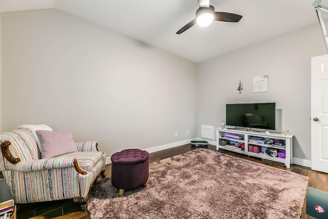 sitting room featuring ceiling fan, lofted ceiling, and dark wood-type flooring