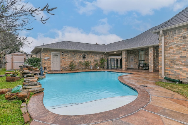 view of pool featuring a storage shed