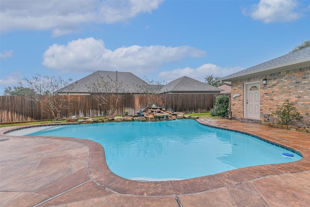 view of swimming pool with a patio area