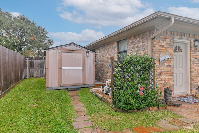 view of outbuilding featuring a yard