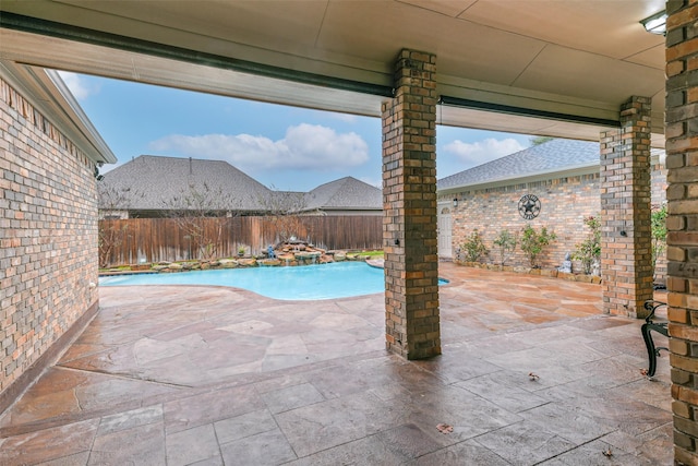 view of swimming pool with a patio