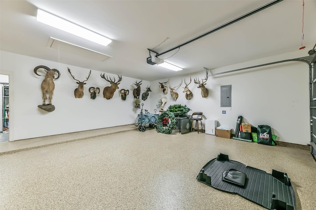 garage featuring electric panel and a garage door opener