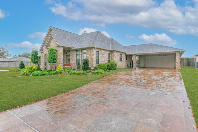 view of front of house with a garage and a front lawn