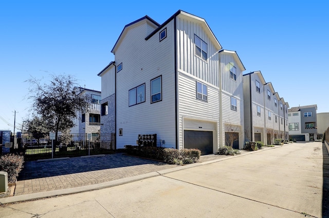 view of side of property featuring a garage