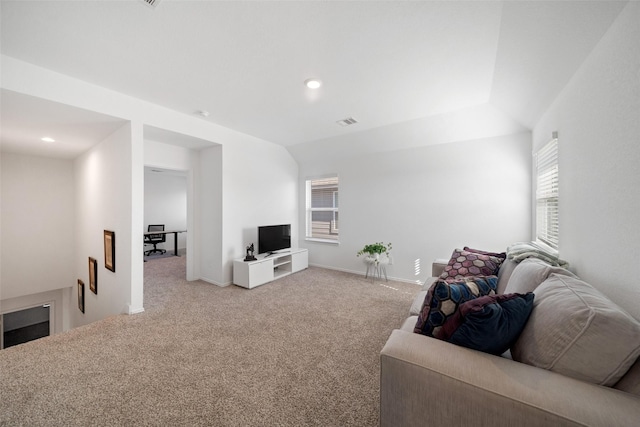 living room featuring carpet and lofted ceiling