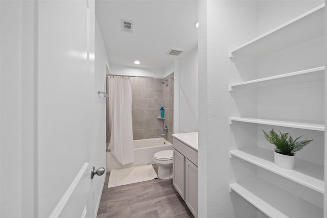 full bathroom featuring toilet, vanity, shower / tub combo with curtain, and hardwood / wood-style floors