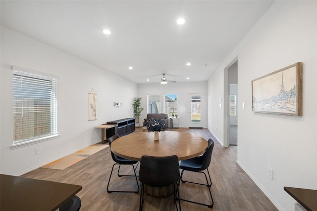 dining space featuring hardwood / wood-style flooring and ceiling fan