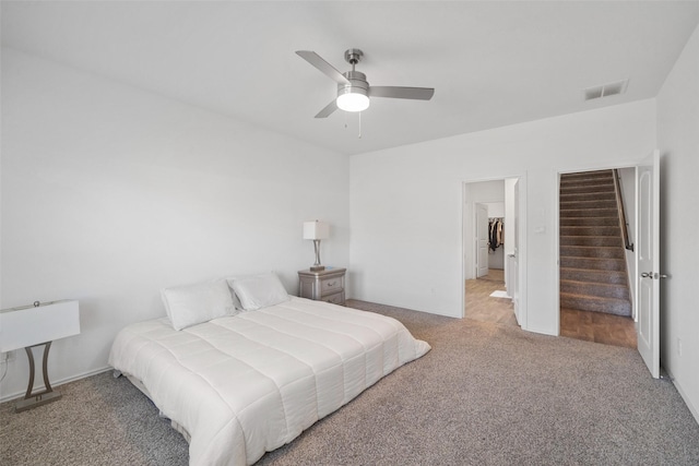 bedroom with ceiling fan and carpet