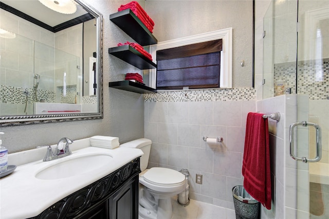 bathroom featuring walk in shower, vanity, crown molding, tile walls, and toilet