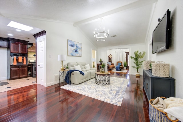 living room with lofted ceiling with beams, an inviting chandelier, dark wood-type flooring, and crown molding