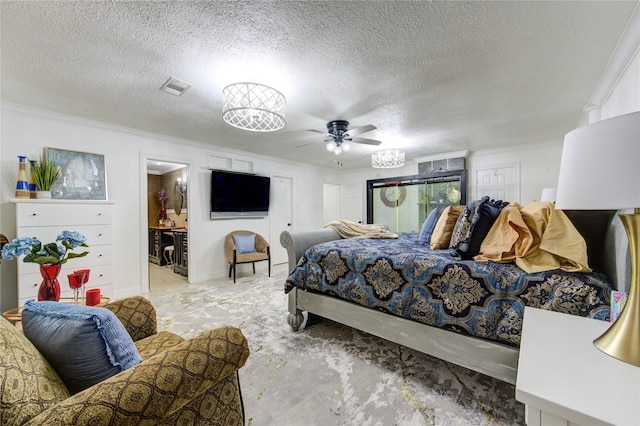 bedroom with ceiling fan, crown molding, and a textured ceiling