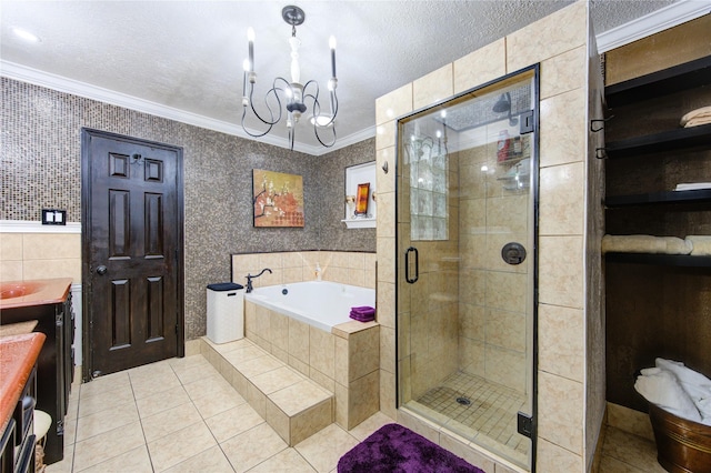 bathroom featuring plus walk in shower, tile patterned flooring, vanity, tile walls, and ornamental molding