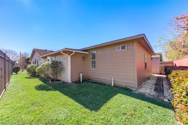 view of property exterior featuring a lawn