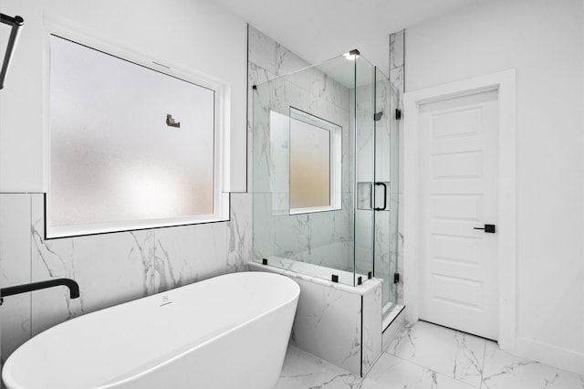 bathroom with shower with separate bathtub