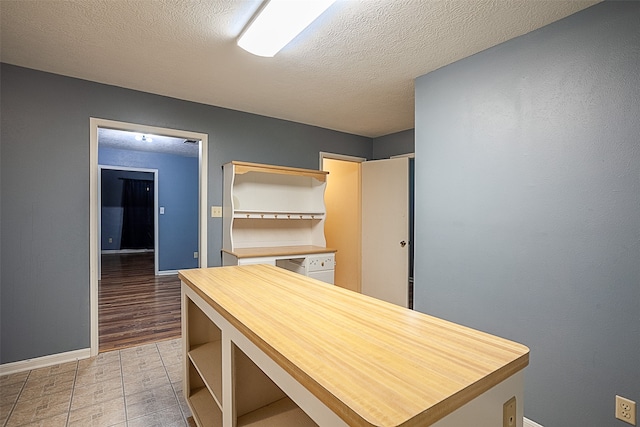 interior space with a textured ceiling