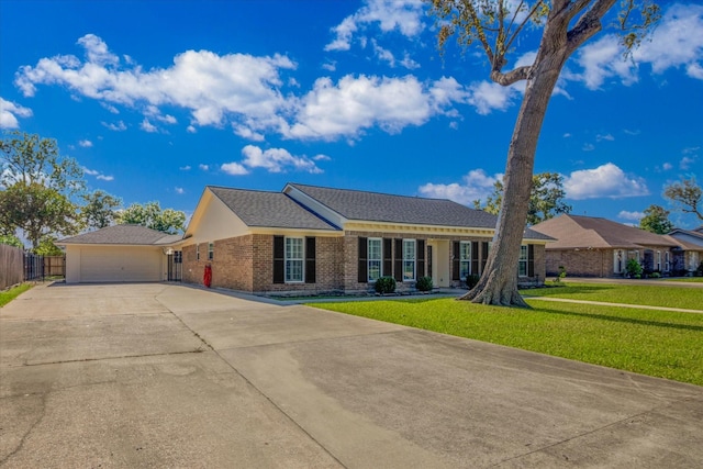 ranch-style house with a garage and a front yard