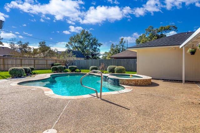 view of swimming pool with an in ground hot tub and a patio