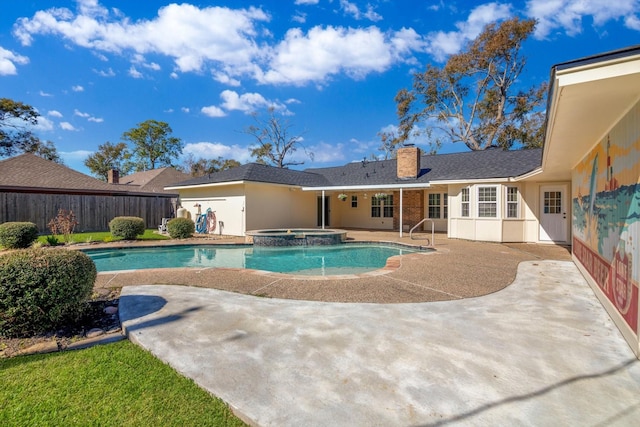 view of pool with an in ground hot tub and a patio