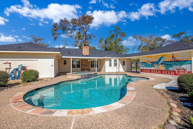 view of pool with an in ground hot tub and a patio