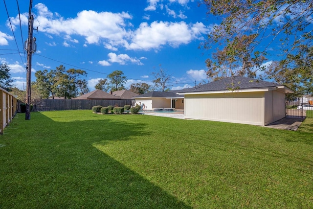 view of yard featuring a fenced in pool and a patio area