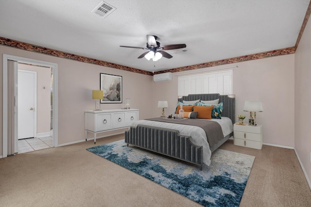 carpeted bedroom featuring a wall mounted AC, a textured ceiling, and ceiling fan