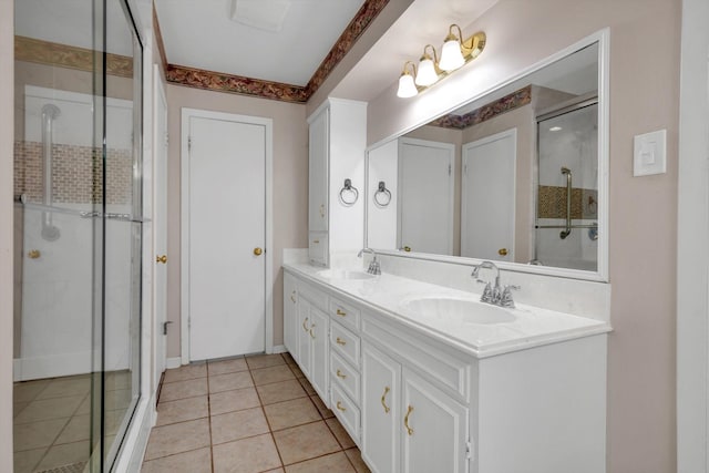 bathroom with tile patterned floors, vanity, and walk in shower