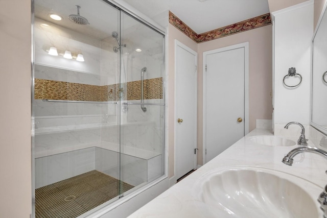 bathroom with vanity and an enclosed shower