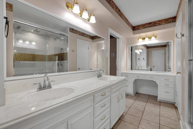 bathroom with tile patterned flooring, vanity, and a shower with shower door