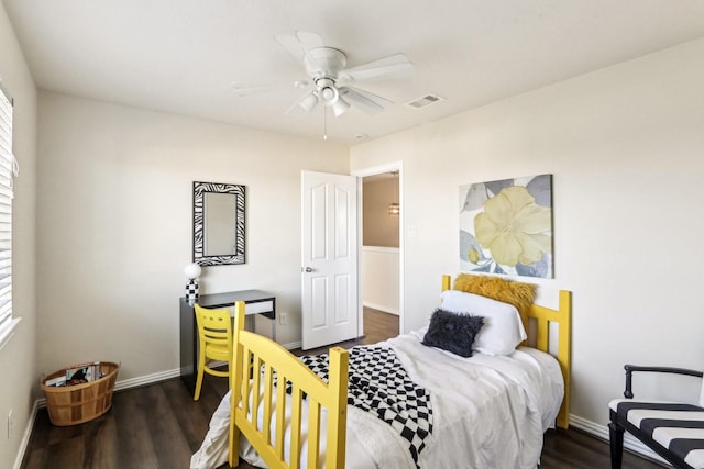 bedroom with ceiling fan and dark hardwood / wood-style flooring