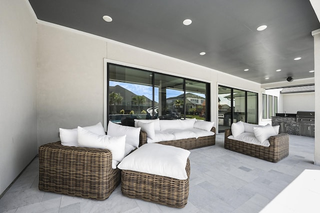 view of patio with grilling area and an outdoor kitchen