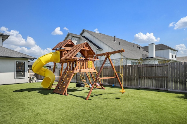 view of playground with a lawn