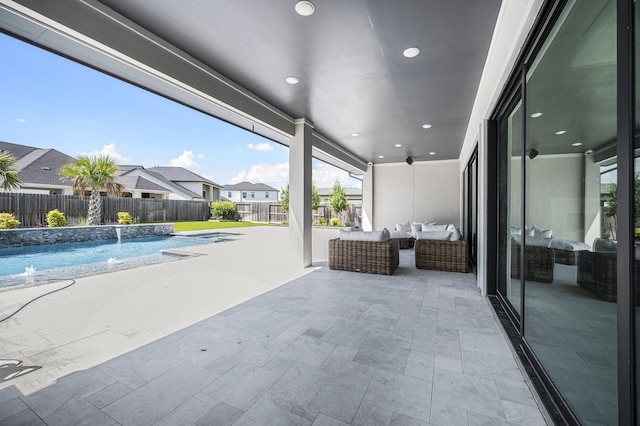 view of swimming pool featuring pool water feature, a patio area, and outdoor lounge area