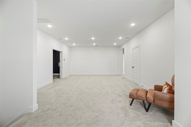 living area featuring light colored carpet