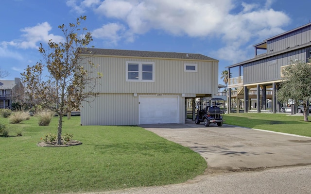 view of side of property with a carport, a lawn, and concrete driveway