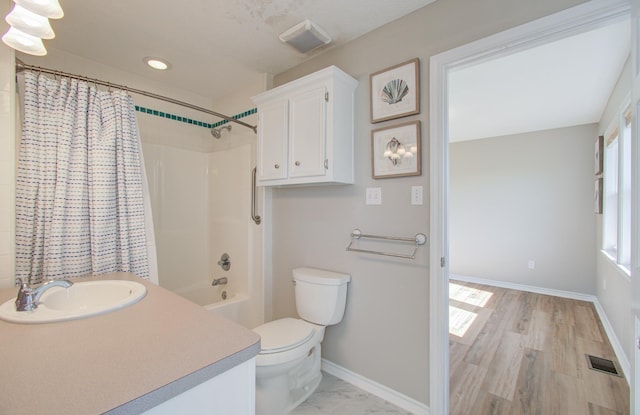 bathroom with visible vents, toilet, recessed lighting, baseboards, and vanity